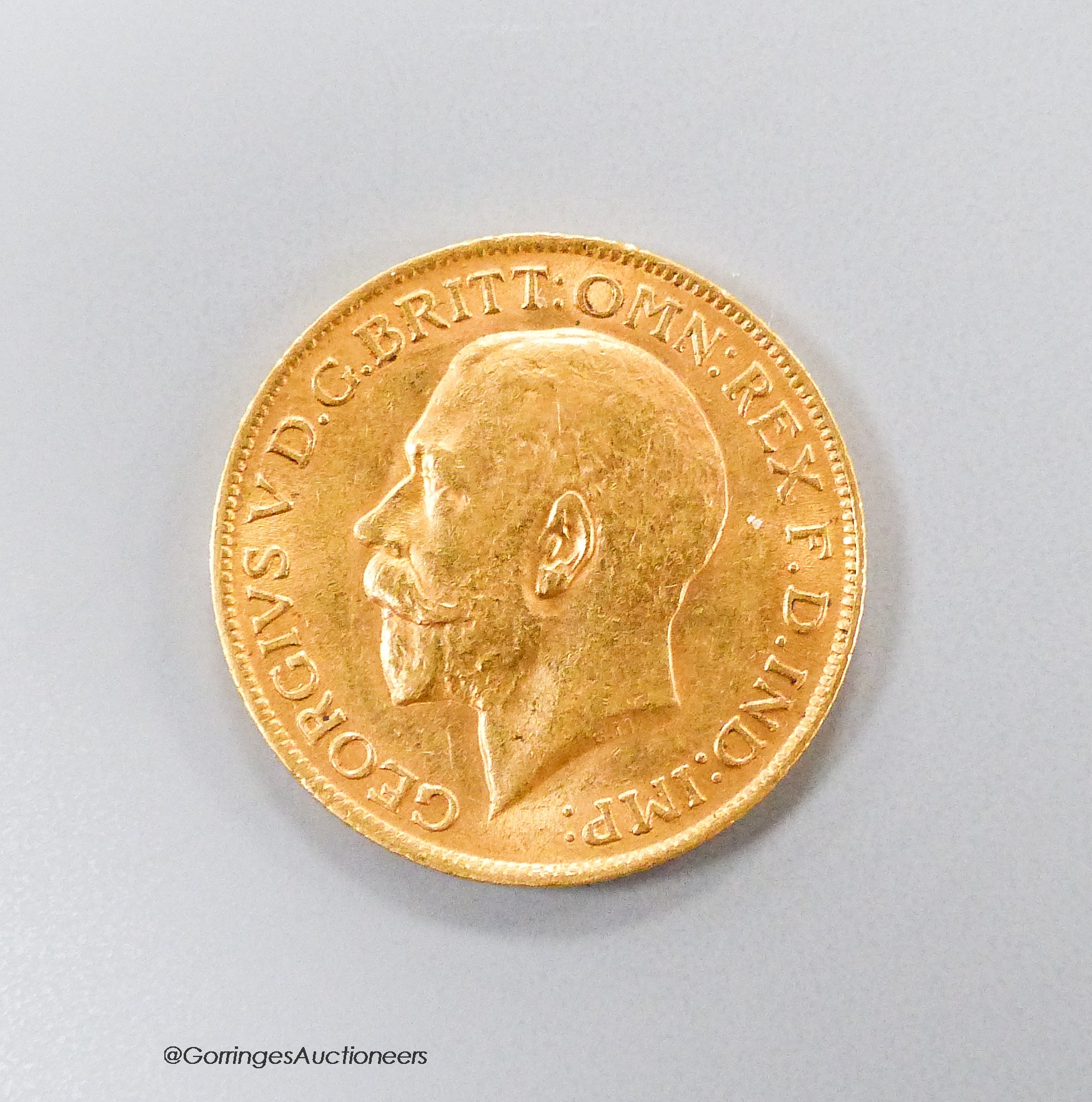 A George V 1912 gold sovereign, GVF.